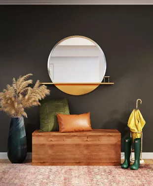 Image of a small sofa with a mirror